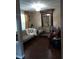 Inviting living room with elegant decor, ornate mirror, and stylish furniture at 13020 Lorna Pl, Tampa, FL 33618