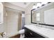 Stylish bathroom with walk-in shower, marble vanity, and sleek fixtures at 13040 Hanley Dr, Spring Hill, FL 34609
