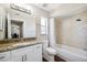 Bathroom featuring vanity, granite counters, a large mirror and tub/shower combo at 13040 Hanley Dr, Spring Hill, FL 34609