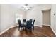 Well-lit dining room area with a glass table, modern chairs and views out the window at 13040 Hanley Dr, Spring Hill, FL 34609
