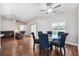Dining room view showcasing the wood floors, stylish seating and views into the living room at 13040 Hanley Dr, Spring Hill, FL 34609