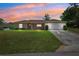 Charming single-story home with a well-manicured lawn and attached two-car garage at 13040 Hanley Dr, Spring Hill, FL 34609