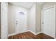 Inviting foyer with beautiful wood-look floors and a decorative front door at 13040 Hanley Dr, Spring Hill, FL 34609