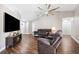 Spacious living room with vaulted ceiling, hardwood floors, and comfortable seating at 13040 Hanley Dr, Spring Hill, FL 34609