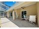 A covered patio features neutral colors, a ceiling fan, and overlooks the pool area at 13040 Hanley Dr, Spring Hill, FL 34609