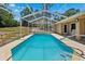 Refreshing screened-in pool in a private backyard setting, perfect for relaxation at 13040 Hanley Dr, Spring Hill, FL 34609