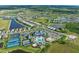 Scenic aerial shot of community featuring homes, lakes, recreation center and surrounding landscape at 14727 Eagle Branch Dr, Nokomis, FL 34275