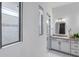Bathroom showcasing a glass-enclosed shower and white vanity with modern fixtures and marble floor tiling at 14727 Eagle Branch Dr, Nokomis, FL 34275