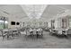 Spacious event space featuring elegant lighting, neutral decor, and plenty of seating at 14727 Eagle Branch Dr, Nokomis, FL 34275