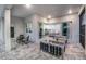 Back patio with comfortable furniture, sliding glass doors and covered seating area at 14727 Eagle Branch Dr, Nokomis, FL 34275