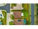 Aerial view highlights the property lines, showcasing a home with a lush green lawn at 1535 Crossvine Ct, Trinity, FL 34655