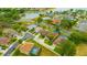 Aerial view of a home with a well-maintained lawn and close proximity to neighborhood amenities at 1535 Crossvine Ct, Trinity, FL 34655