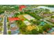 Aerial view of the home near community park, lake and playground at 1535 Crossvine Ct, Trinity, FL 34655