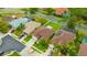 Aerial view of neighborhood featuring well-maintained lawns and beautiful landscaping at 1535 Crossvine Ct, Trinity, FL 34655