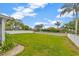 Well maintained backyard shows a green lawn with an outer perimeter fence at 1535 Crossvine Ct, Trinity, FL 34655