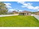 Lush green backyard with privacy fence provides a peaceful setting at 1535 Crossvine Ct, Trinity, FL 34655