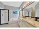 Bright bathroom featuring a shower, bathtub, and double sink vanity at 1535 Crossvine Ct, Trinity, FL 34655