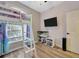 bedroom featuring a bunk bed, TV, aquarium, and built in shelving at 1535 Crossvine Ct, Trinity, FL 34655