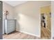 This bedroom features wood floors, fresh paint, and a dresser for ample storage at 1535 Crossvine Ct, Trinity, FL 34655