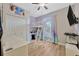 bedroom featuring a bunk bed, TV, closet, and built in desk at 1535 Crossvine Ct, Trinity, FL 34655
