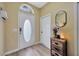 Inviting entryway featuring wood-look flooring and an oval glass accent in the front door for natural light at 1535 Crossvine Ct, Trinity, FL 34655