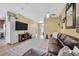 Open living room with tan walls and a comfortable leather couch at 1535 Crossvine Ct, Trinity, FL 34655