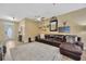 Spacious living room with tan walls and a comfortable leather couch at 1535 Crossvine Ct, Trinity, FL 34655