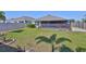Fenced backyard with screened lanai offers privacy and plenty of space for outdoor activities at 16704 Sunburst Lake St, Wimauma, FL 33598
