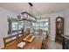 Bright dining room includes a sliding glass door and view of the outdoor patio at 16704 Sunburst Lake St, Wimauma, FL 33598
