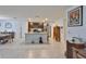 Open concept kitchen and dining area with a large island, modern appliances, and ample natural light at 16704 Sunburst Lake St, Wimauma, FL 33598