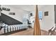bedroom with a swing, a desk with a chair, and a black and white painted wall at 18017 Ramble On Way, Land O Lakes, FL 34638