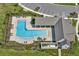 Aerial view of a beautiful community pool and lounge area perfect for relaxation at 18017 Ramble On Way, Land O Lakes, FL 34638