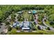 Aerial view of a charming community with a clubhouse, pool, and picturesque landscaping at 18017 Ramble On Way, Land O Lakes, FL 34638