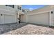Spacious driveway with a two-car garage and beautiful landscaping provides ample parking and curb appeal at 18017 Ramble On Way, Land O Lakes, FL 34638