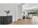 Inviting entryway featuring modern decor and stylish furniture, leading to a spacious living area at 18017 Ramble On Way, Land O Lakes, FL 34638