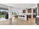 Open kitchen with an island and sliding doors opening to the outdoor grill and patio at 18017 Ramble On Way, Land O Lakes, FL 34638