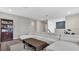 Spacious living room with a large sectional sofa, stylish coffee table, and neutral color palette at 18017 Ramble On Way, Land O Lakes, FL 34638