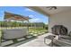 Covered patio features hot tub, ceiling fan, outdoor furniture, and a trampoline at 18017 Ramble On Way, Land O Lakes, FL 34638