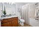 Bathroom featuring vanity, granite countertop, toilet and shower-tub at 18677 Milton Keynes Ct, Land O Lakes, FL 34638