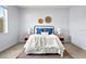 Bright bedroom featuring a cozy bed with stylish decor, bedside tables, and ample natural light at 18677 Milton Keynes Ct, Land O Lakes, FL 34638