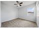 Bedroom featuring carpet, neutral paint, and ceiling fan at 18677 Milton Keynes Ct, Land O Lakes, FL 34638
