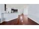 Open concept kitchen with granite countertops, stainless steel appliances, and dark wood cabinets at 18677 Milton Keynes Ct, Land O Lakes, FL 34638