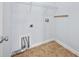 Functional laundry room with tile flooring, hookups, and storage options, perfect for easy laundry days at 18677 Milton Keynes Ct, Land O Lakes, FL 34638