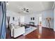 View of the living room leading to the kitchen, dining area and a hallway to another room at 18677 Milton Keynes Ct, Land O Lakes, FL 34638