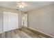Bedroom with wood flooring, closet, neutral paint and a ceiling fan at 1980 Taylor Lake Cir, Largo, FL 33778