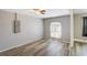 Bedroom with wood floors and a large window for natural light, creating a bright and airy atmosphere at 1980 Taylor Lake Cir, Largo, FL 33778