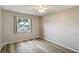Bedroom featuring wood flooring, natural light, and neutral walls at 1980 Taylor Lake Cir, Largo, FL 33778