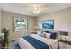 Virtually staged bedroom with modern decor and natural light at 1980 Taylor Lake Cir, Largo, FL 33778