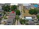 Aerial view of a neighborhood street featuring charming homes and lush trees at 2130 W Spruce St, Tampa, FL 33607