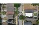 Overhead shot of homes with unique roof designs, sidewalks, and lush greenery at 2130 W Spruce St, Tampa, FL 33607